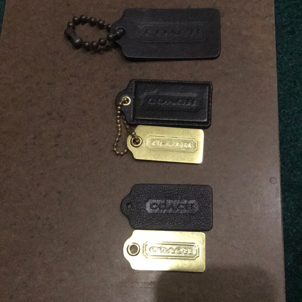 Black and brass tag